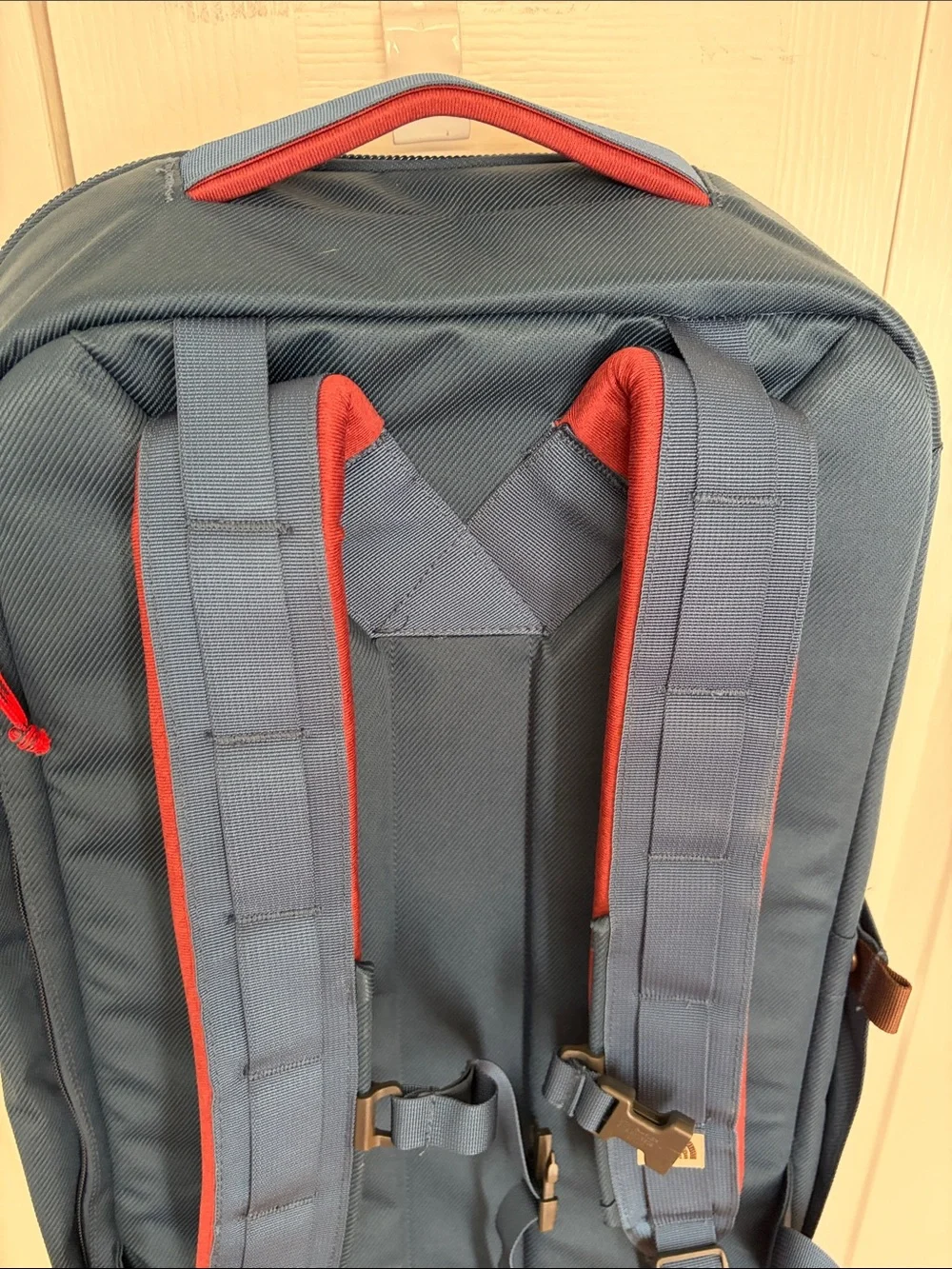 The North Face Travel Duffel Blue Backpack with Red Accents